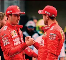  ?? AFP ?? Qua la mano Charles Leclerc, 22 anni con Sebastian Vettel, 32