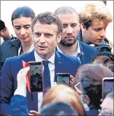  ?? AFP ?? French President Emmanuel Macron (centre) greets supporters at the city hall in Denain, northern France, on Monday.