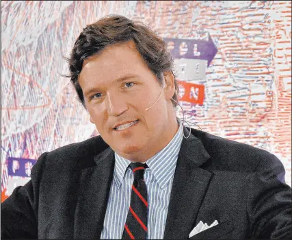  ?? Jim Ruymen Upi/shuttersto­ck ?? Like a misguided liberal of days gone by, Tucker Carlson celebrates Russia’s superiorit­y over the U.S.