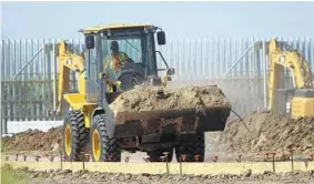  ?? DELCIA LOPEZ/THE MONITOR ?? Equipment works on constructi­on of a border wall on private land Dec. 9 in Mission, Texas.