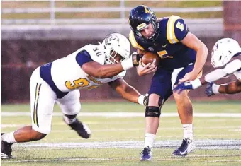  ?? STAFF PHOTO BY ROBIN RUDD ?? UTC defensive linemen Devonnsha Maxwell, left, and Ben Brewton combine to sack East Tennessee State’s Trey Mitchell on Oct. 17, 2019 at Finley Stadium.