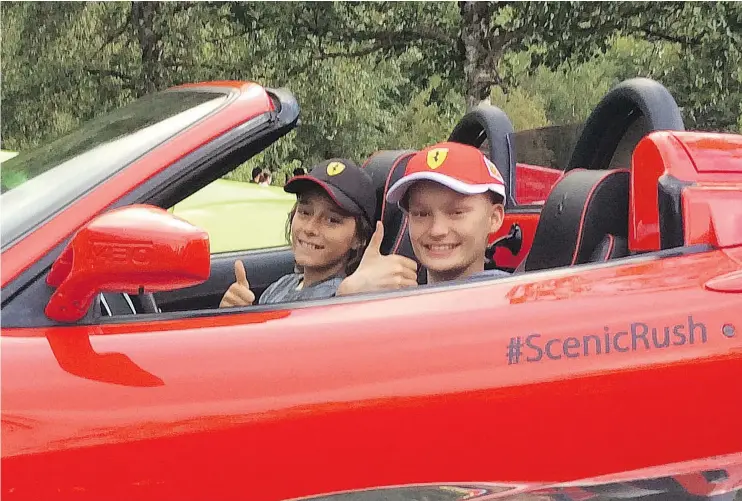  ??  ?? Aidan MacAulay, in the driver’s seat, rides with his buddy, Nicholas Daal, during the Scenic Rush supercar day trip last summer. The ride has sparked a special event on Sunday.