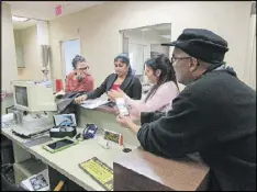  ??  ?? Helping set up the new Assistive Technology Lab at Cobb Senior Services are (from left) Tara Brewer (program specialist), Jobcy Alexander (nutrition program coordinato­r), Dawn Hedley (Life University intern) and Jack Thompson (nutrition program...