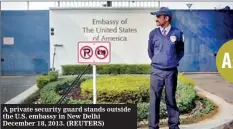  ??  ?? A private security guard stands outside the U.S. embassy in New Delhi December 18, 2013. (REUTERS)