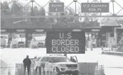  ?? LARS HAGBERG/AFP ?? A sign says that the border is closed at the U.S.-Canada border in March in Lansdowne, Ontario.