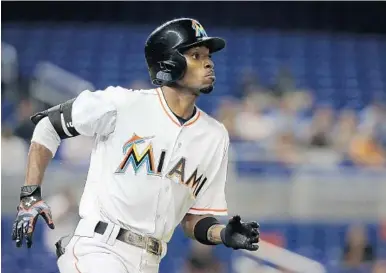  ?? MIKE EHRMANN/GETTY IMAGES ?? Dee Gordon was the first of several Marlins to be dealt when the club traded him to the Mariners for prospects.