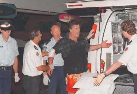  ?? ?? One of the victims is helped into an ambulance after Jacqueline Leyden and John Ski were stabbed to death. Picture: Mike Batterham