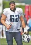  ?? THE ASSOCIATED PRESS ?? Tennessee Titans offensive lineman Corey Levin takes a break during an offseason workout in May in Nashville. Levin was a standout at UTC before being taken in the sixth round of the NFL draft this past spring.