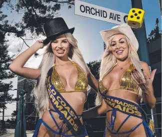  ?? Picture: JERAD WILLIAMS ?? Meter Maids Tiy Rusnik and Nicole Dolly are just as curious as the rest of us about the role of the gold bikini in the Gold Coast version of Monopoly.