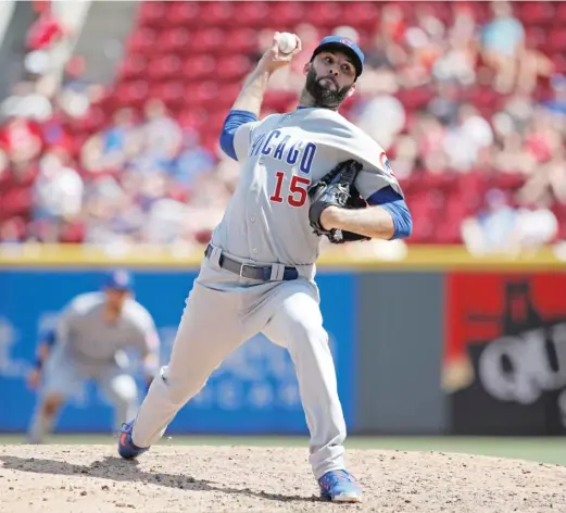  ?? JOE ROBBINS/GETTY IMAGES ?? Relief pitcher Brandon Morrow made 35 appearance­s for the Cubs in 2018 before injuring his elbow. He pitched in zero games last season.