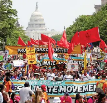  ?? PHOTO: TASOS KATOPODIS/EPA ?? HOT AND BOTHERED: With the temperatur­e exceeding 30 degrees, protesters march from the US Capitol to the White House during the People’s Climate March.