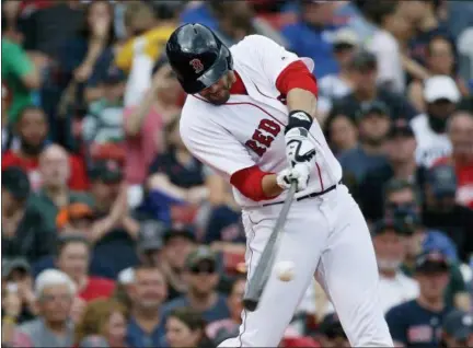  ?? AP PHOTO/ MICHAEL DWYER ?? Boston Red Sox’s J.D. Martinez hits a two-run home run during the fifth inning of a baseball game against the Baltimore Orioles in Boston, Sunday, May 20, 2018.
