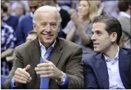  ?? NICK WASS — THE ASSOCIATED PRESS FILE ?? Vice President Joe Biden, left, with his son Hunter, right, attend a Duke Georgetown NCAA college basketball game in Washington. Since the early days of the United States, leading politician­s have had to contend with awkward problems posed by their family members. Joe Biden is the latest prominent politician to navigate this tricky terrain.