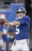  ?? JOHN BLAINE/ FOR THE TRENTONIAN ?? Giants’ Davis Webb warms up prior to a preseason game against the Patriots. Webb, who was surprising­ly cut by the Giants, signed with the Jets on Tuesday. The Associated Press