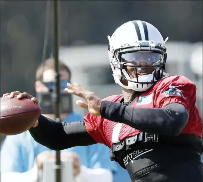  ?? GERRY BROOME — THE ASSOCIATED PRESS ?? Carolina Panthers quarterbac­k Cam Newton passes during a training camp practice with the Buffalo Bills in Spartanbur­g, S.C., Tuesday.