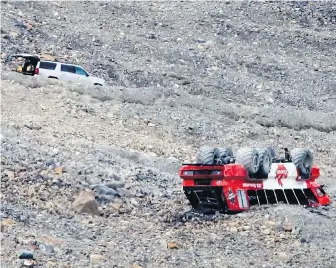  ??  ?? A sightseein­g bus rolled at Columbia Icefield near Jasper, Alta. on July 18. Three people died and 24 were injured.