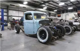  ??  ?? THE ’36 FORD PARKED NEXT TO THE ’37 RUNS AN LS ENGINE MOUNTED LOW IN THE CHASSIS. IT ALSO HAS A TRICK PARALLEL 4-LINK WITH A CUSTOM PAN-HARD BAR.