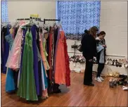  ?? ?? Racks of new and gently used dresses were set up and displayed with other items such as shoes and jewelry at Miracles in Motion in Boyertown.