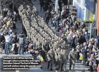  ?? JONATHAN PORTER/KELVIN BOYES ?? Soldiers from 2 Rifles marching through Lisburn yesterday and (right) Battalion Colonel The Earl of Wessex and well-wishers along the parade route