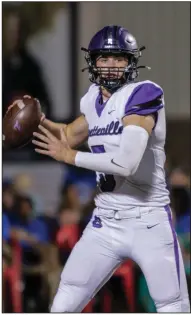  ?? (Special to NWA Democrat-Gazette/Brent Soule) ?? Drake Lindsey ( 5) steps back to pass during the 2022 season against Bentonvill­e. Lindsey will be one of the top returning quarterbac­ks in the state this season for the Bulldogs.