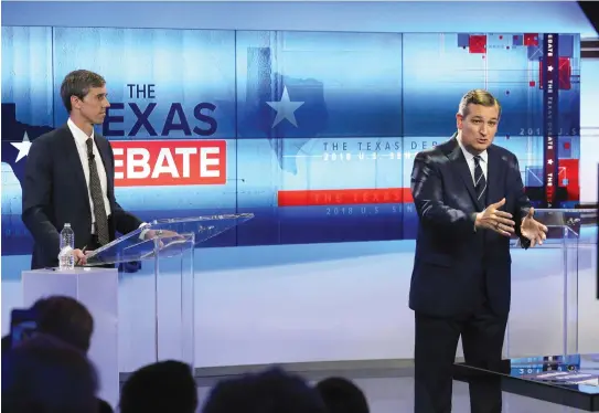  ?? (Reuters) ?? US SENATOR Ted Cruz speaks as his opponent Beto O’Rourke looks on.