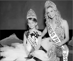  ?? — Photo courtesy of the Mini Miss Committee ?? Oceane Scharre, 10, elected Mini Miss France 2011, sits with Miss France 2011 Mathilde Florin.