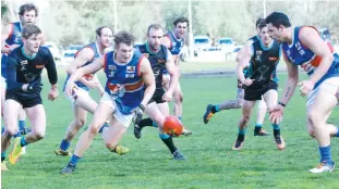  ??  ?? Right: Bunyip’s Lachlan Petch and Nathan Lieshout lead in the race for the ball as Cora Lynn opponents Nicholas Helsby and Nathan Langley close in