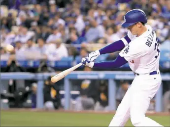  ?? Harry How/Getty Images ?? Rookie Cody Bellinger helps give the Dodgers a 3-0 first-inning lead with a two-run homer off Chad Kuhl Wednesday night at Dodger Stadium. Kuhl lasted five innings, but gave up four runs on six hits in the Pirates’ 5-2 loss.