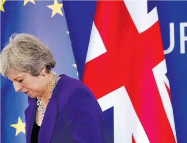  ?? ALASTAIR GRANT / THE ASSOCIATED PRESS ?? British Prime Minister Theresa May predicts “more difficult moments” in the final stages of Brexit talks.