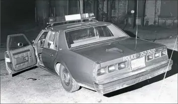  ??  ?? Slain police shief's car, with his necktie on the trunk, sits at scene of shooting in Saxonburg. Chief Gregory Adams was killed Dec. 4, 1980.