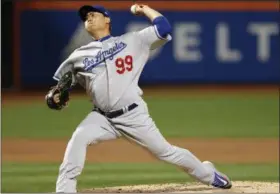  ?? KATHY WILLENS — ASSOCIATED PRESS ?? Dodgers starting pitcher Hyun-Jin Ryu throws during the first inning of the team’s 8-0 win over the Mets at Citi Field on Sunday night.