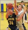  ?? THOMAS NASH - DIGITAL FIRST MEDIA ?? Upper Perk’s Tyler Keyser (34) pumpfakes before converting a basket in the paint during Tuesday night’s game against Pope John Paul II.