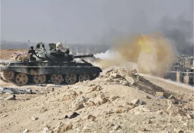  ?? PICTURE: AFP/GETTY IMAGES ?? A Syrian government forces’ tank fires rounds in the eastern city of Deir el-zour during an operation to liberate the city from Islamic State