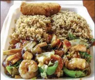  ?? Arkansas Democrat-Gazette/ROSEMARY BOGGS ?? The shrimp and vegetable entree at Asia Express in Cabot is made with large shrimp and tender crisp vegetables. It is served with rice and an egg roll.