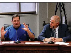  ?? Arkansas Democrat-Gazette/THOMAS METTHE ?? Dr. Carlos Roman (left), seated with fellow marijuana board member James Miller, said Thursday that hiring a consultant seemed “the quickest way” to assess firms seeking to dispense cannabis in the state.