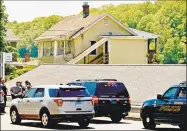  ?? Peter Hvizdak / Hearst Connecticu­t Media ?? State Police in front of a house in Derby on May 24 where a man was found dead during the search for suspected murderer Peter Manfredoni­a, 23