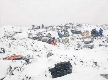  ?? Azim Afif ?? TENTS AND GEAR are strewn across the base camp at 17,500 feet in a photo from a Malaysian climbing team. Seventeen people were confirmed dead and many others unaccounte­d for or stranded on the mountain.