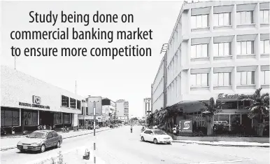  ??  ?? Branches of Jamaica’s two largest banks sit on opposite sides at the entrance to the business district, at Knutsford Boulevard in New Kingston. A new study has been commission­ed to assess competitio­n within the commercial banking sector.