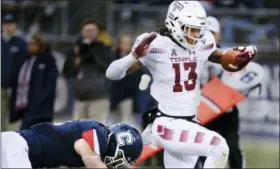  ?? STEPHEN DUNN — THE ASSOCIATED PRESS ?? Temple wide receiver Isaiah Wright (13) scores the first touchdown of the first half of an NCAA college football game against Connecticu­t, Saturday in East Hartford, Conn.