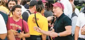  ?? ALEX BRANDON/AP ?? Commanders owner Josh Harris greets fans with Virginia Gov. Glenn Youngkin before practice at the team’s training facility Thursday in Ashburn, Virginia.