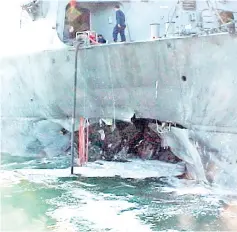  ??  ?? File photo shows the port side of the guided missile destroyer USS Cole after a suspected terrorist bomb exploded during a refueling operation in the port of Aden in Yemen. — AFP photo