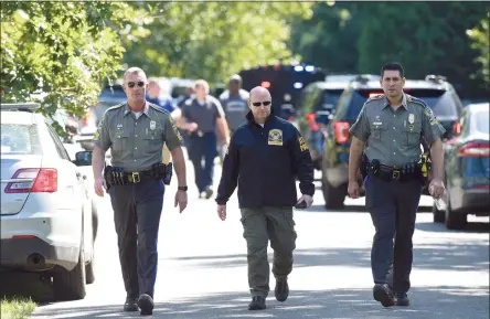  ?? H John Voorhees III / Hearst Connecticu­t Media ?? State and local police and fire units were on River Bend Drive in Woodbury after a veteran Connecticu­t State Police sergeant was killed Thursday after officials say his vehicle was swept away by floodwater­s during Ida.