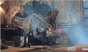  ?? UNIVERSAL PICTURES ?? You’ll have to get past velocirapt­or Blue if you want to mess with her bestie (Chris Pratt) in “Jurassic World: Fallen Kingdom.”