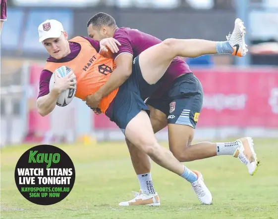  ?? Picture: AAP IMAGE ?? AJ Brimson (left) is tackled by Moses Mbye during Queensland Origin training at Langlands Park this week.