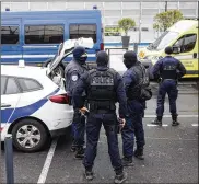  ?? AP ?? French police forces stand outside Orly Airport, south of Paris, on Saturday. Soldiers shot and killed a man who wrestled one of their colleagues to the ground and tried to steal her rifle, officials said.