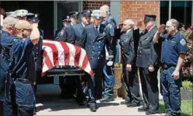  ?? TOM KELLY III – DIGITAL FIRST MEDIA ?? Firefighte­rs carry the casket of volunteer and career fire-fighter Michael Sedlock Jr. from St. Aloysius Church during the funeral ceremony on Friday. Sedlock served the fire service for almost 50 years.