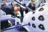  ?? ZHU XINGXIN / CHINA DAILY ?? A visitor to the China Internatio­nal Import Expo in Shanghai checks out a medical-use robot on Tuesday.