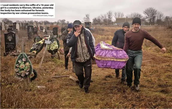  ?? Chris McGrath/Getty Images ?? Local residents carry the coffin of a 16-year-old girl in a cemetery in Kherson, Ukraine, yesterday. Her body has been exhumed for forensic inspection by war crimes prosecutio­n teams.