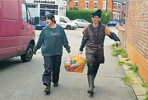  ?? ?? Self-styled Robin Hoods from activism group Everybody Eats posted images and footage of them filling shopping baskets with food and household items in a Manchester M&S Foodhall, top right, before showing off their haul contained in Sainsbury’s bags, below