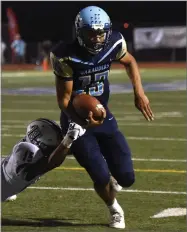  ?? RECORDER PHOTO BY CHIEKO HARA ?? Monache High School’s Antonio Andrade carries the ball near the end zone Thursday during the first quarter at Jacob Rankin Stadium in Portervill­e.